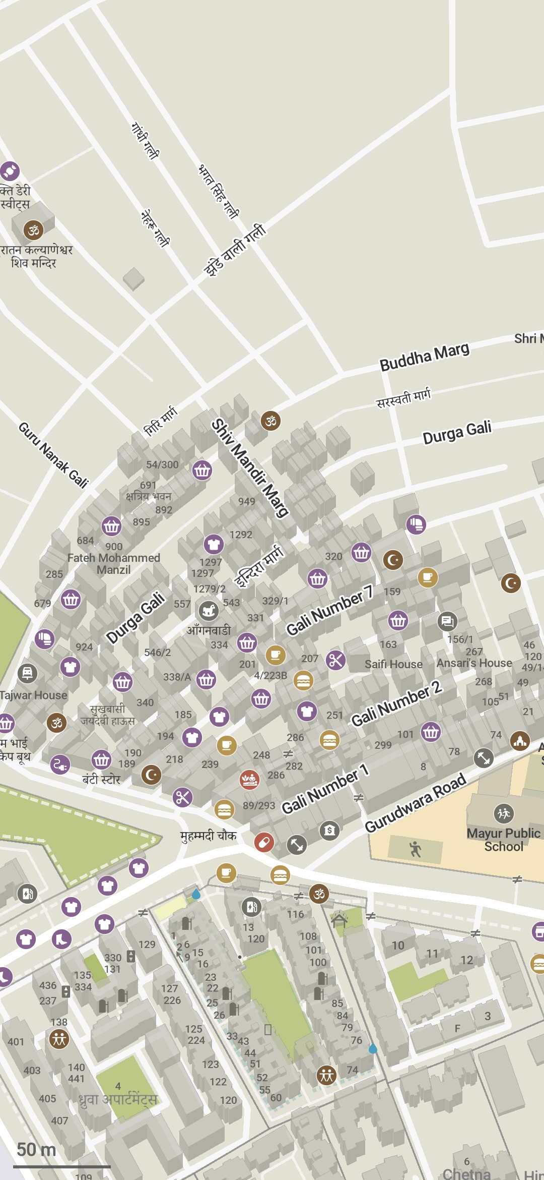 Screenshot of Organic Maps rendering the part of Mandāwali I have been mapping. It's a grey concrete jungle of dense buildings - almost 500 of them. I added building:levels tags for all of them, so they're rendered in delicious 3D. Interspersed among the grey are colorful icons for a handful of the nearly 200 POIs I've added in this area. The missing buildings are the ones with no address signs - I plan to go there again and ask the residents for the house number.

         The area to the north is unmapped, showing only some named streets and a couple of buildings and POIs. In reality, it is just as dense a concrete jungle as the mapped area.

         The area to the south is part of Indraprastha Extension, which is made up of gated societies with larger and less dense buildings, and interspersed with green polygons representing private parks.